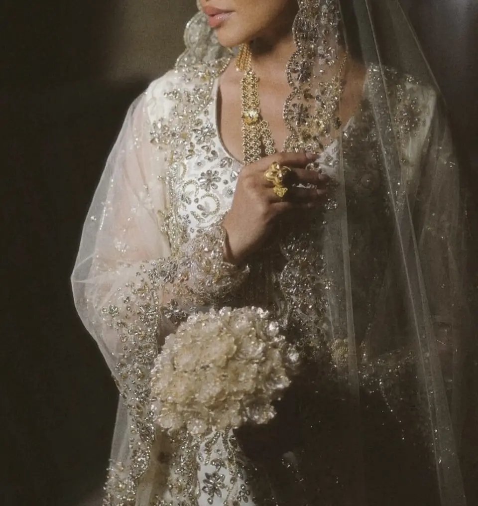 Gold and crystal embroidered bridal bodice with a scalloped embroidered veil