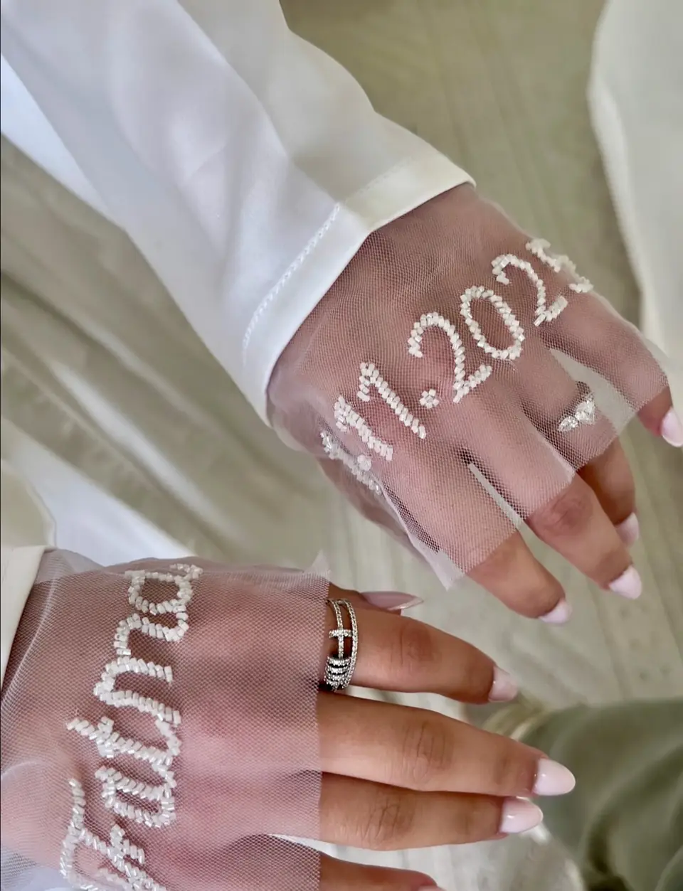 Sheer tulle bridal gloves hand-beaded with a name and wedding date